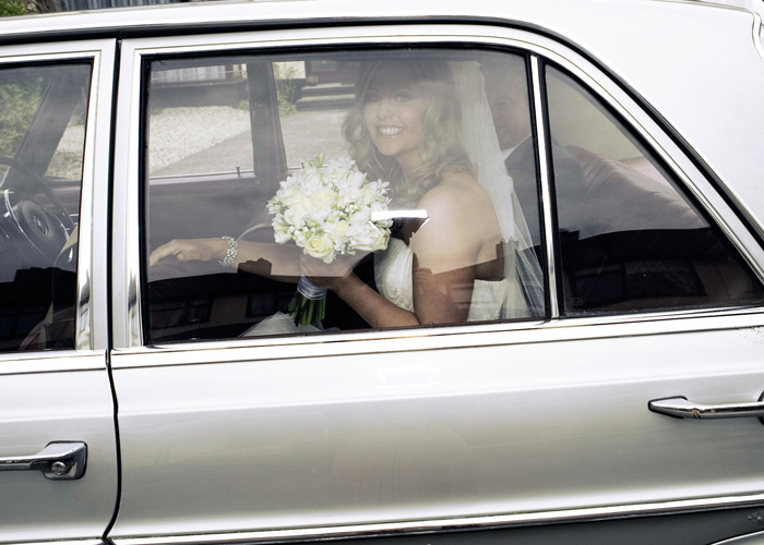bride in wedding car